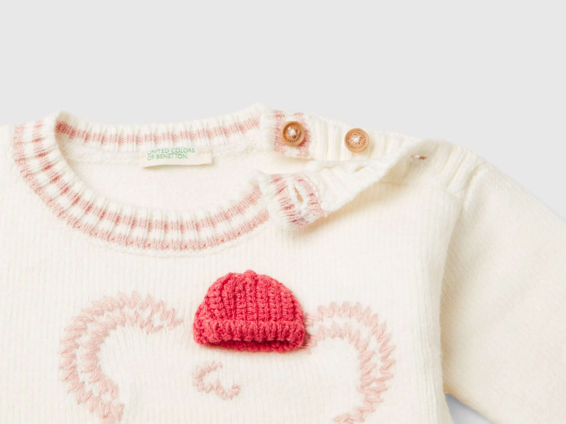 Sweater with embroidery and applique
