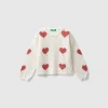 Sweater with heart inlay