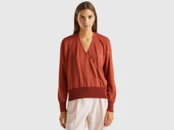 Sweater with opening at back