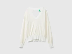 Sweater with opening at back