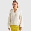 Sweater with perforated sleeve