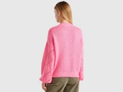 Sweater with perforated sleeve