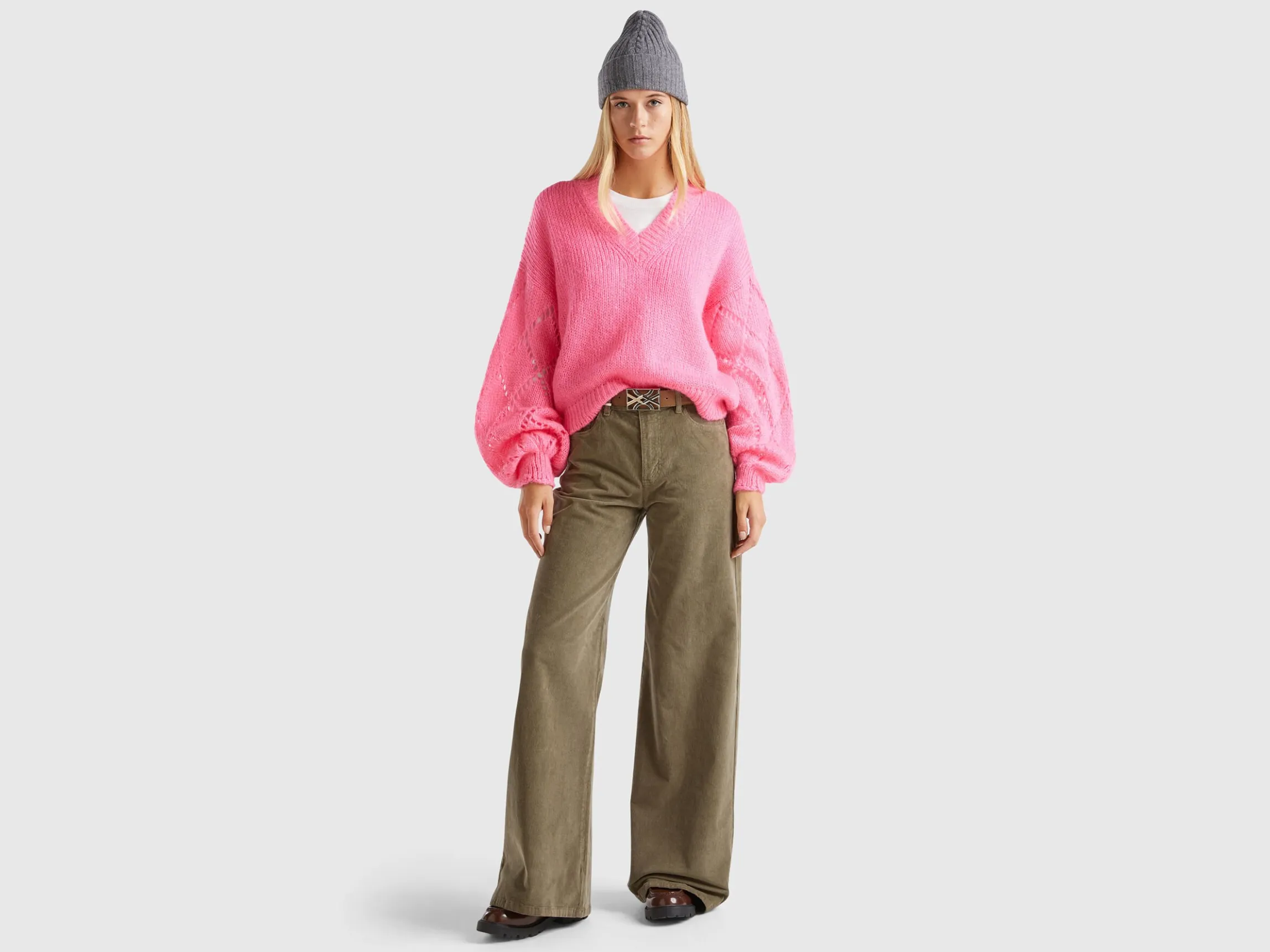 Sweater with perforated sleeve