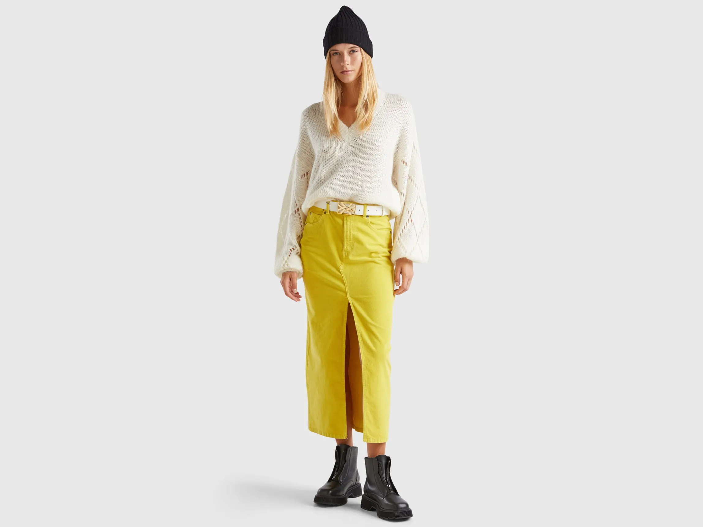 Sweater with perforated sleeve