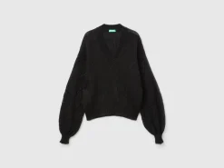 Sweater with perforated sleeve