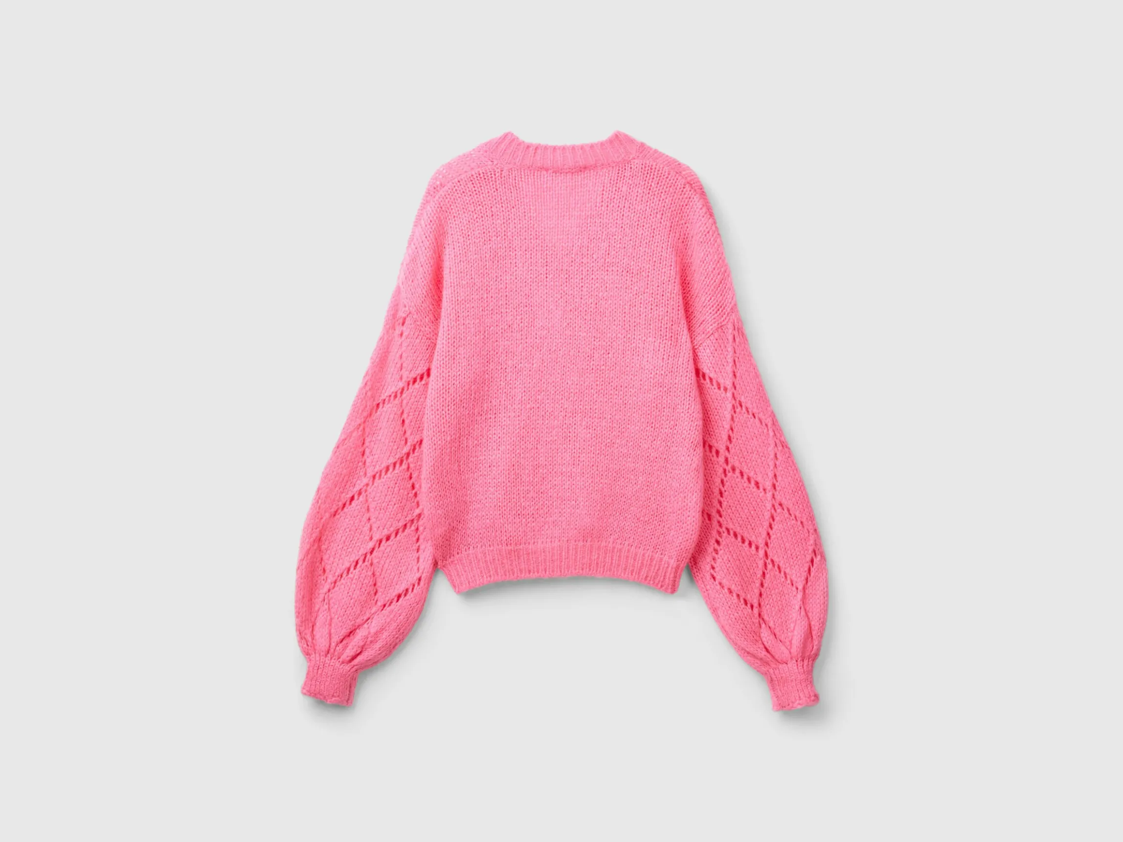Sweater with perforated sleeve