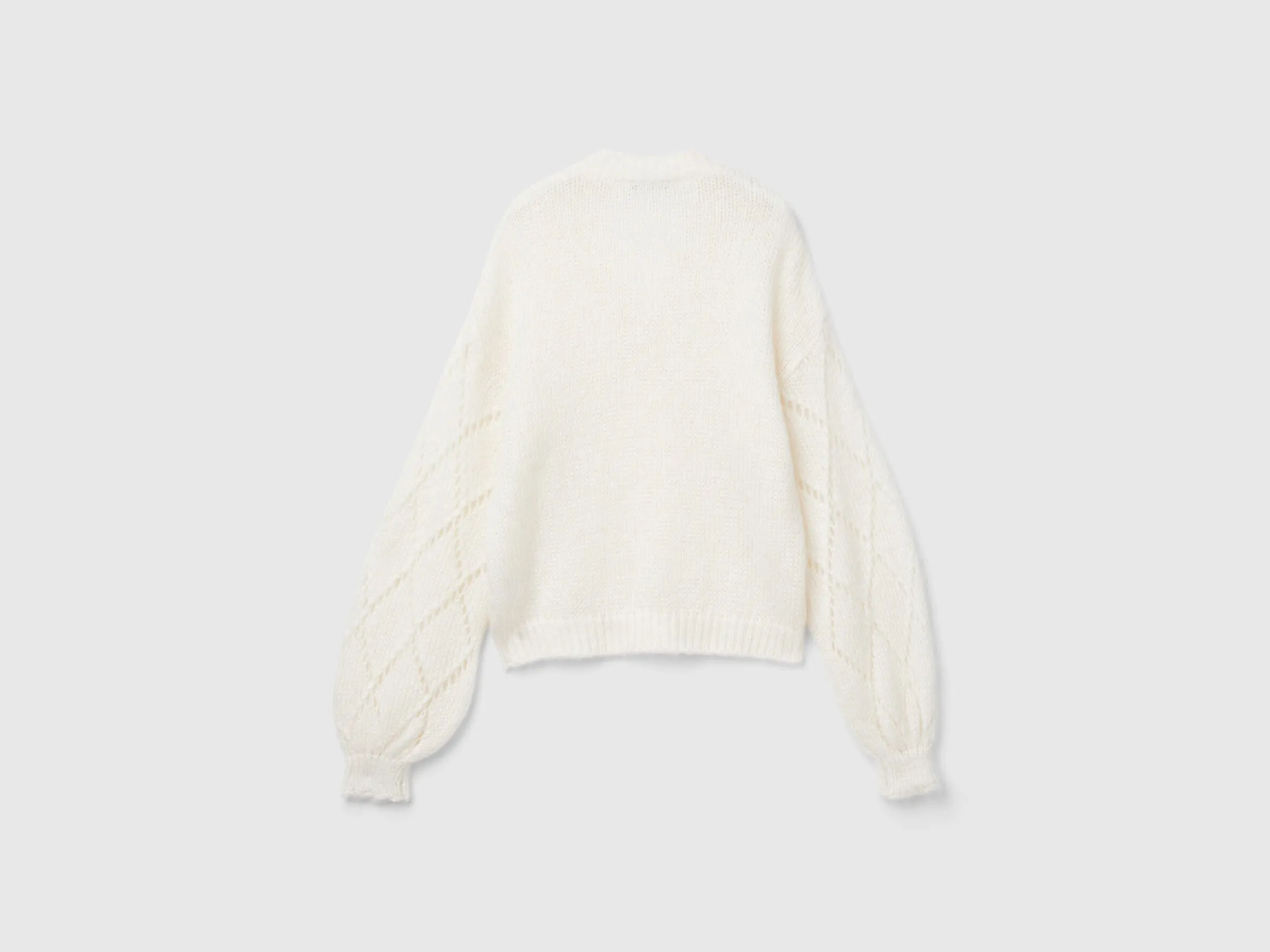 Sweater with perforated sleeve
