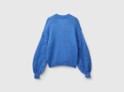 Sweater with perforated sleeve