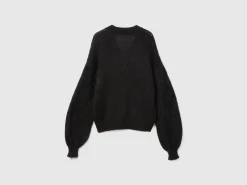 Sweater with perforated sleeve