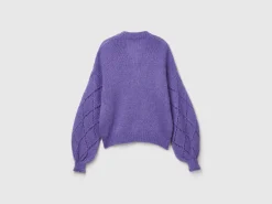 Sweater with perforated sleeve