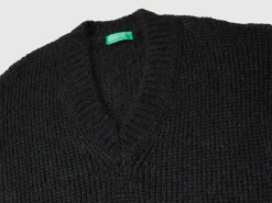 Sweater with perforated sleeve