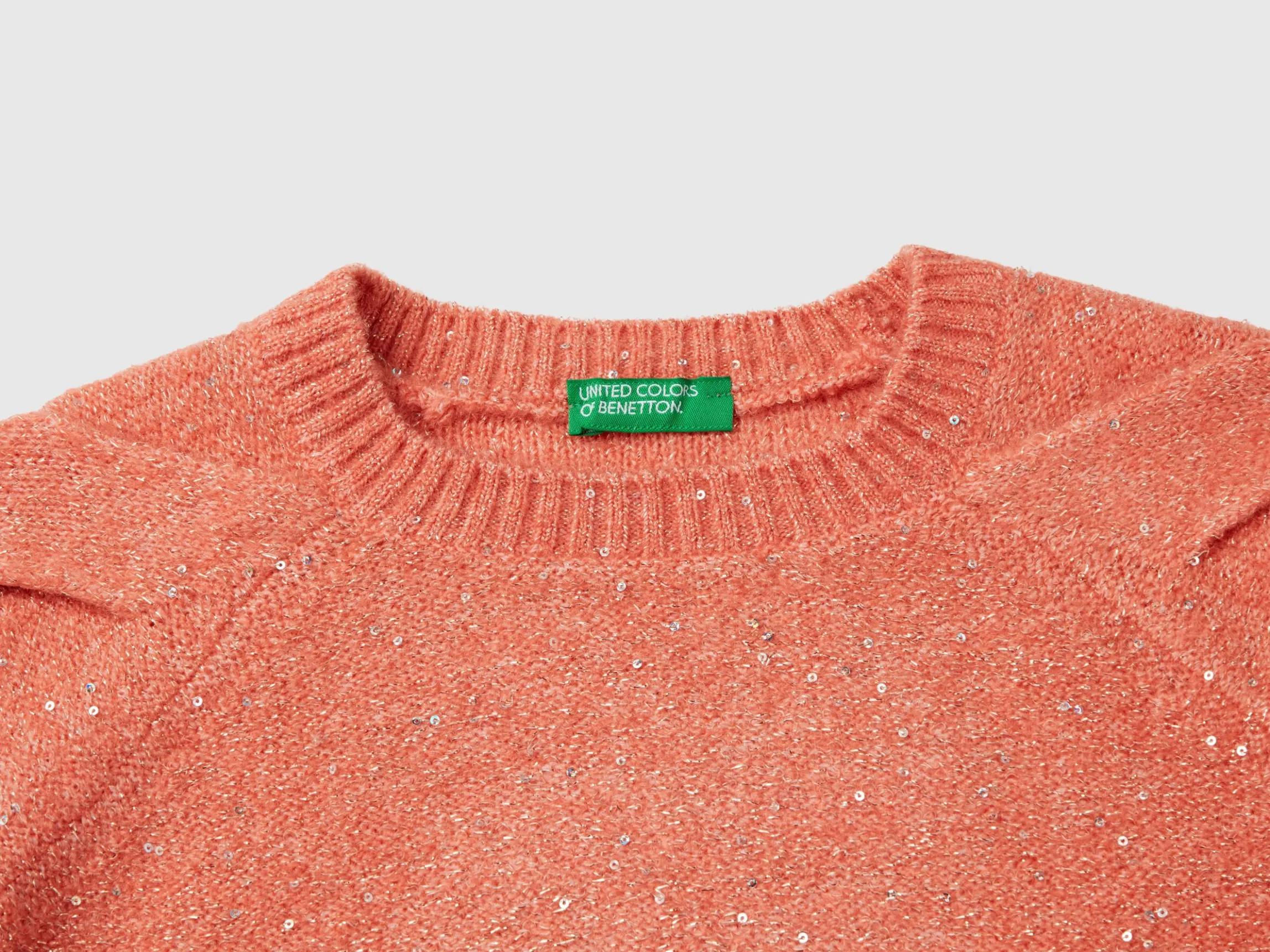 Sweater with recycled fabric and sequins