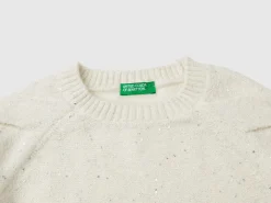 Sweater with recycled fabric and sequins