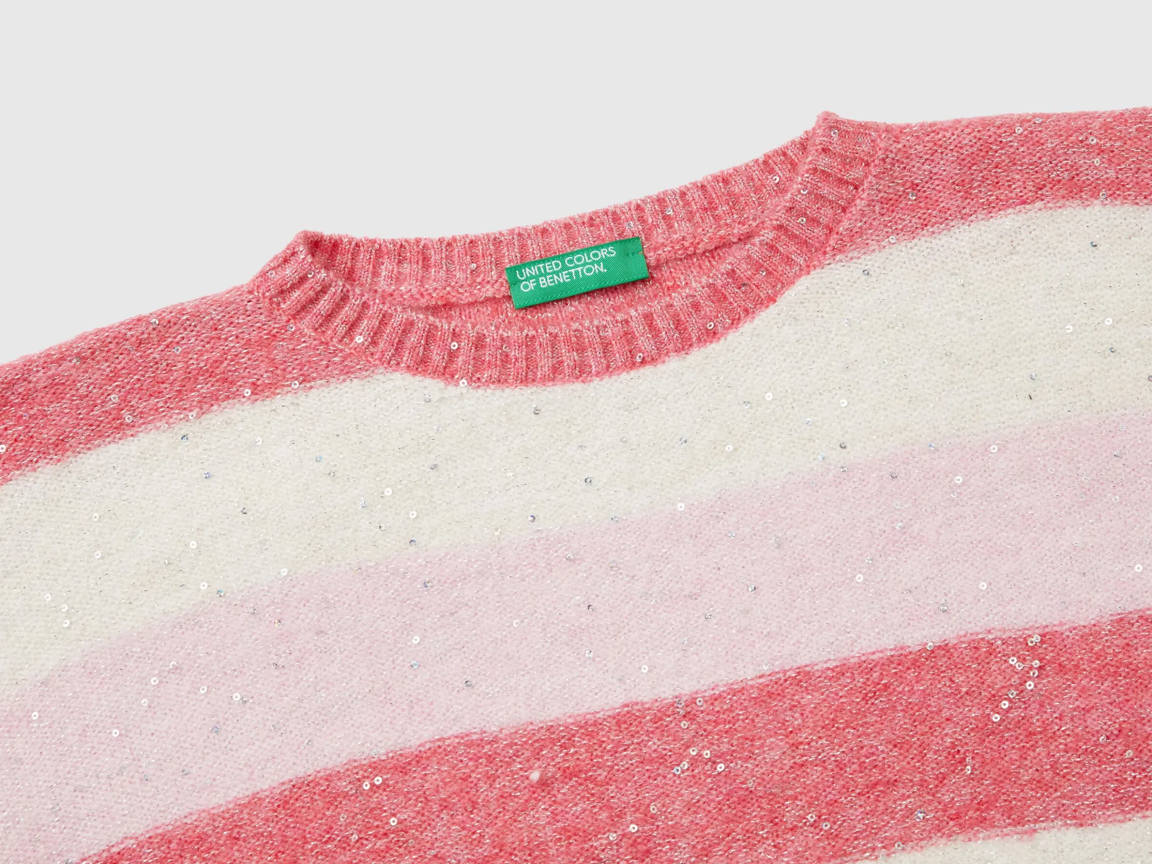 Sweater with recycled fabric and sequins