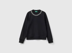 Sweatshirt with jewel effect applique