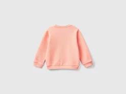 Sweatshirt with petal look applique