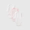 Three solid color bodysuits in organic cotton