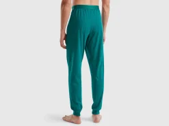 Trousers with elastic logo
