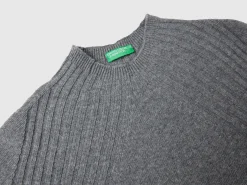 Turtleneck sweater with slits