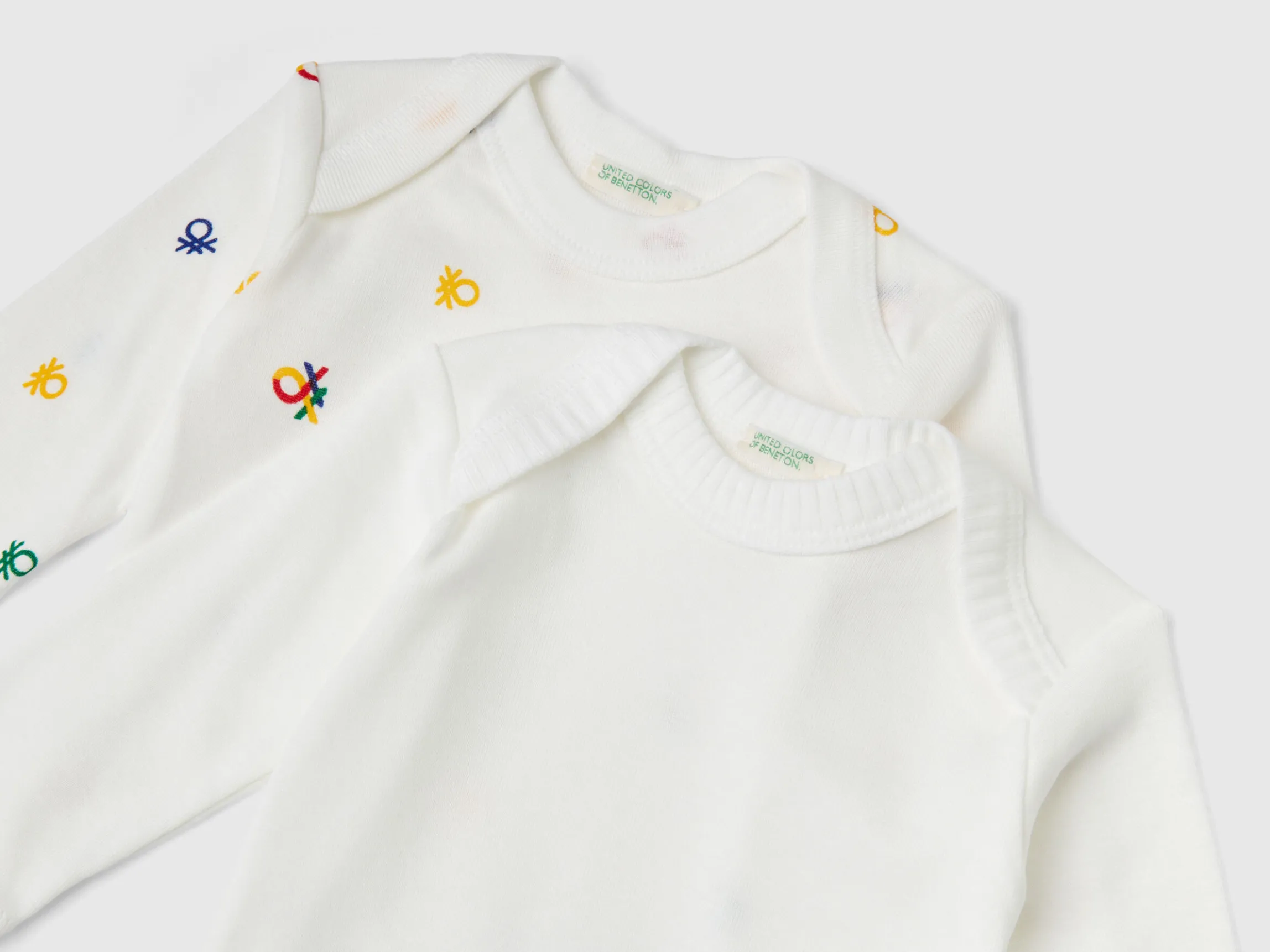 Two long sleeve bodysuits in organic cotton