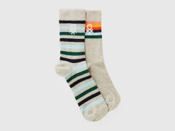 Two pairs of long socks with logos