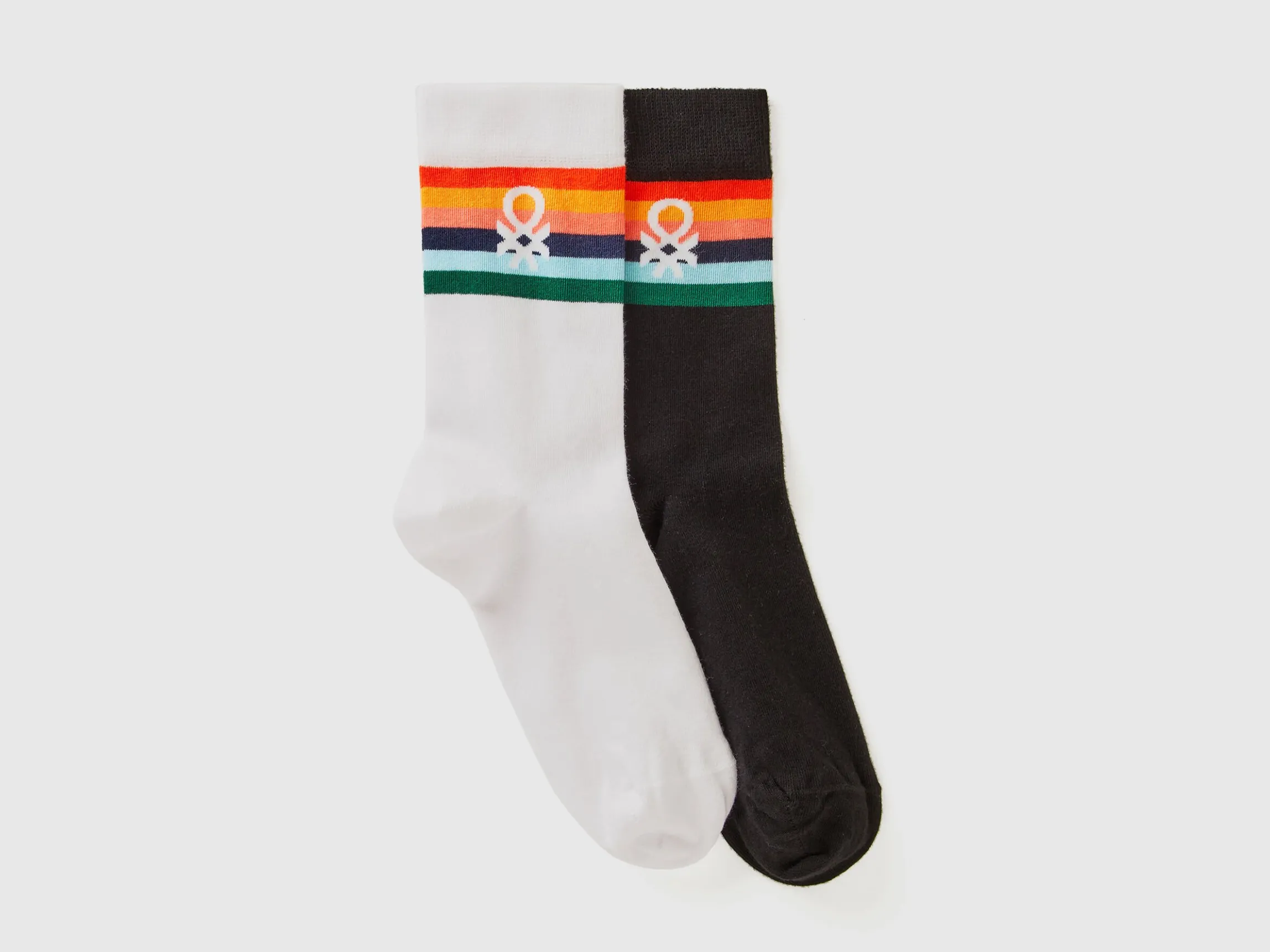 Two pairs of long socks with logos