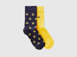 Two pairs of long socks with logos