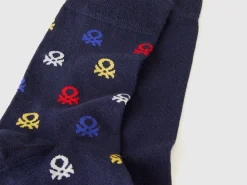 Two pairs of long socks with logos