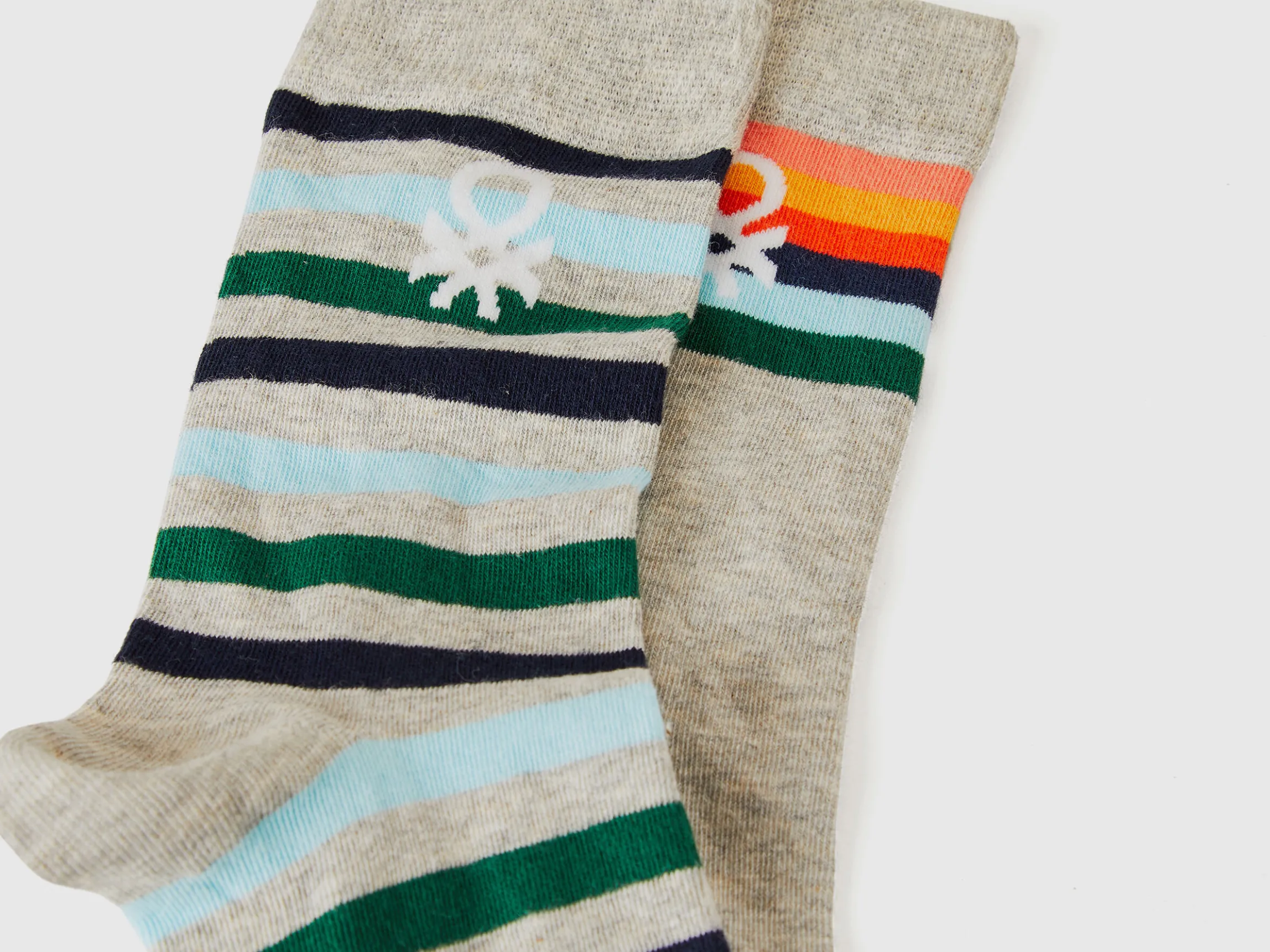Two pairs of long socks with logos