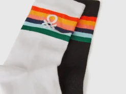Two pairs of long socks with logos