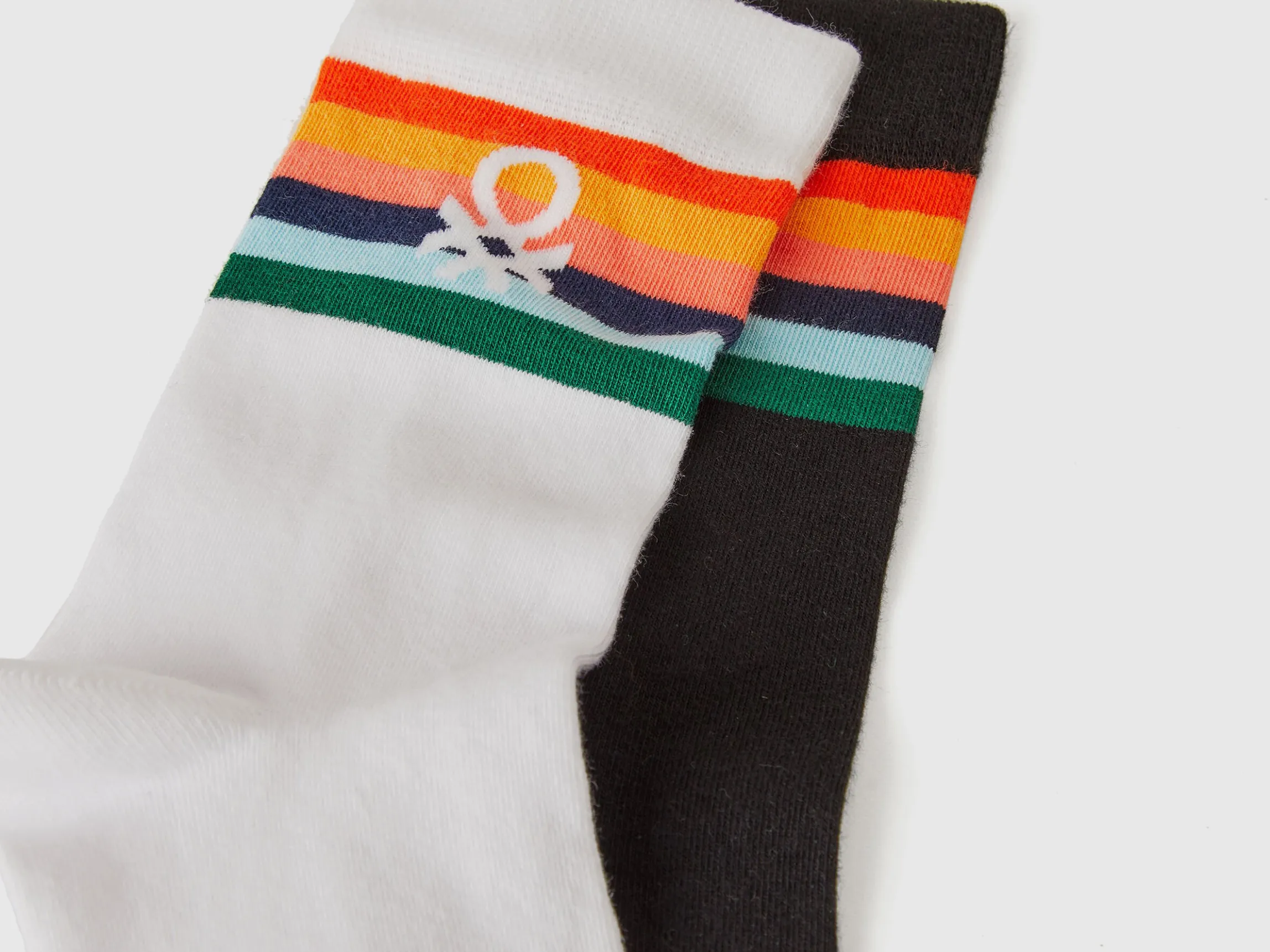 Two pairs of long socks with logos