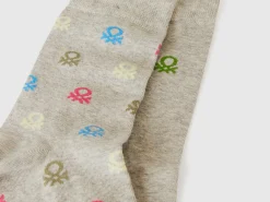 Two pairs of long socks with logos