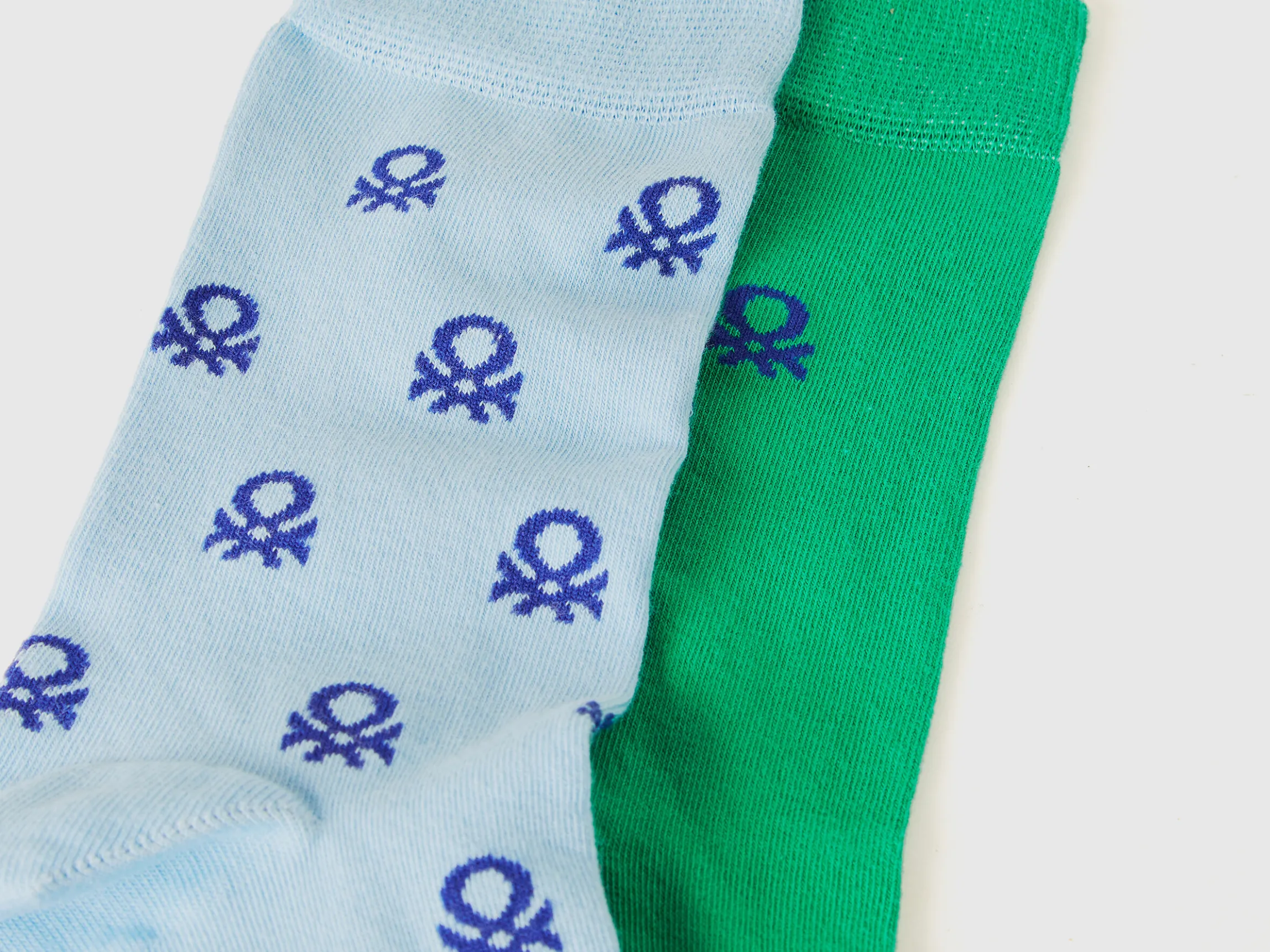 Two pairs of long socks with logos