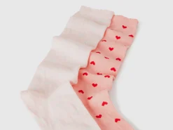 Two pairs of pink heart socks